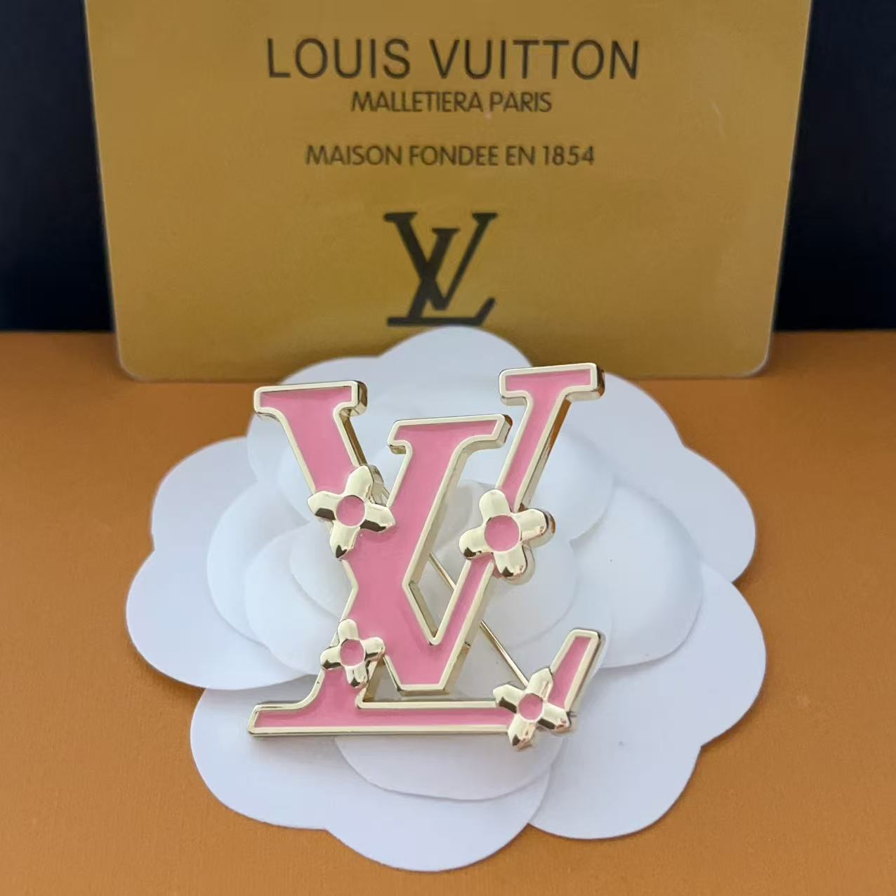 New LV brooch, with label.