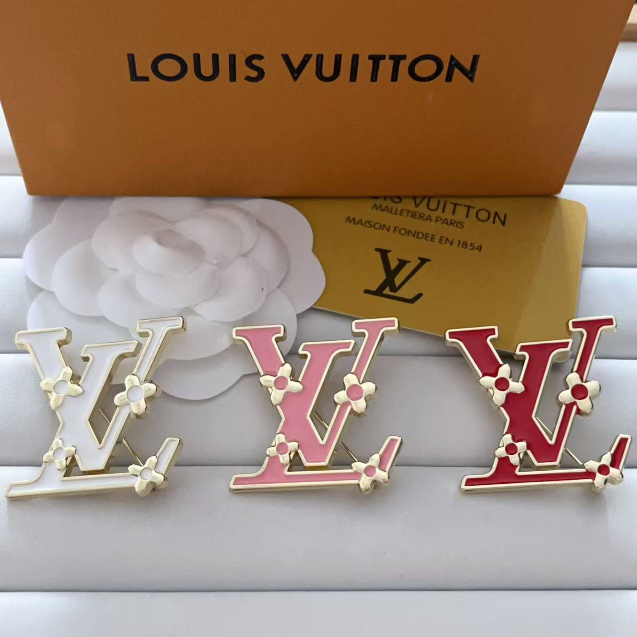 New LV brooch, with label.
