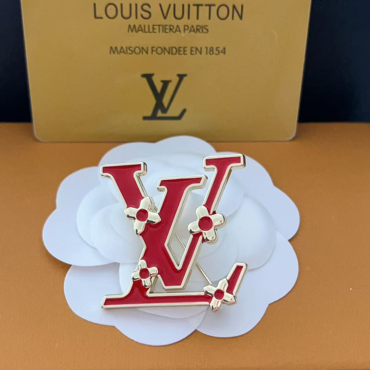 New LV brooch, with label.
