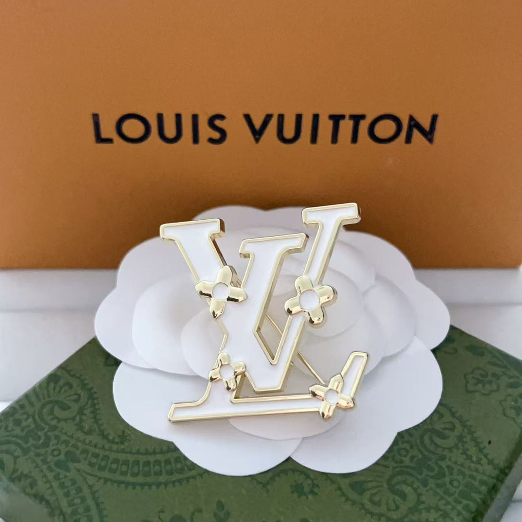 New LV brooch, with label.