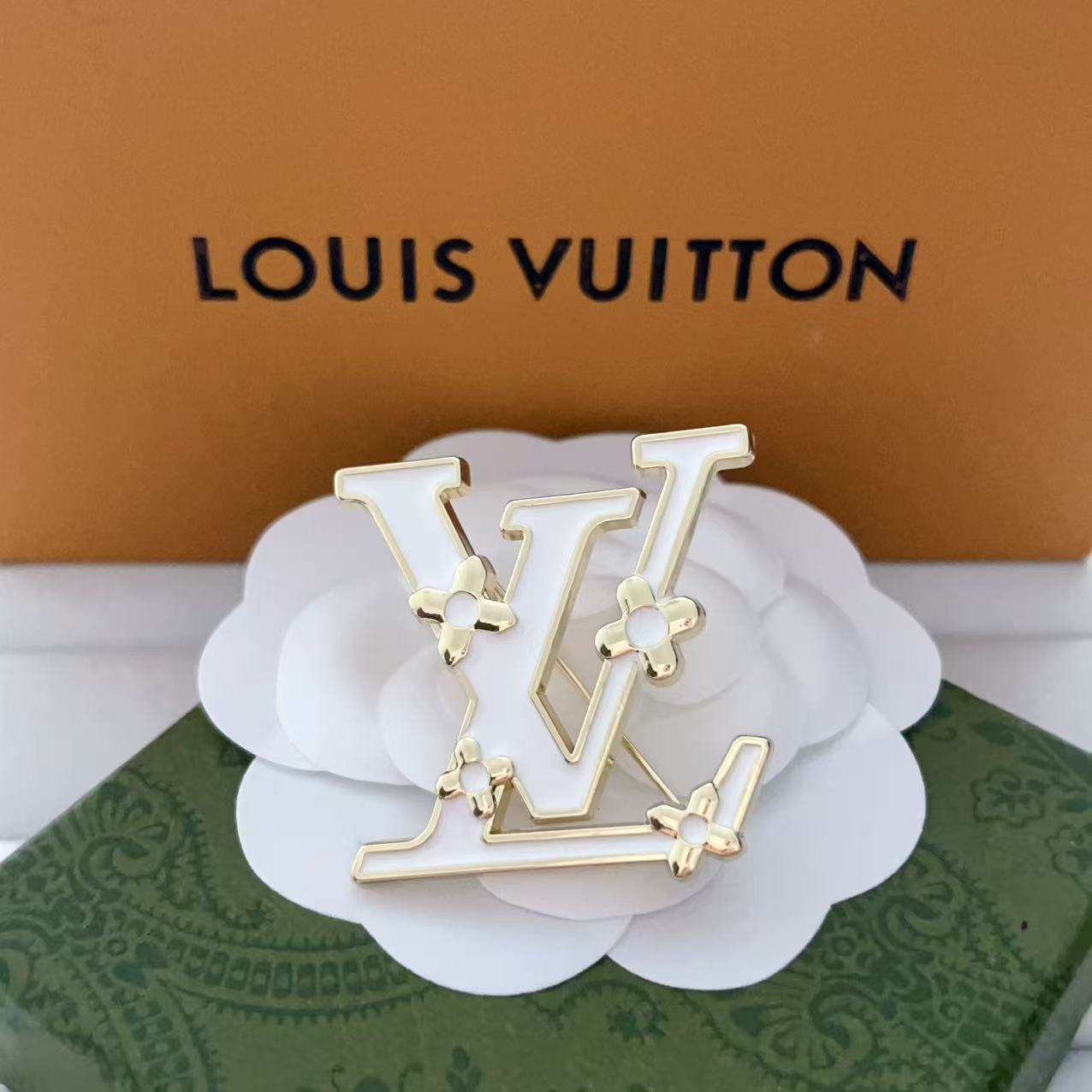 New LV brooch, with label.