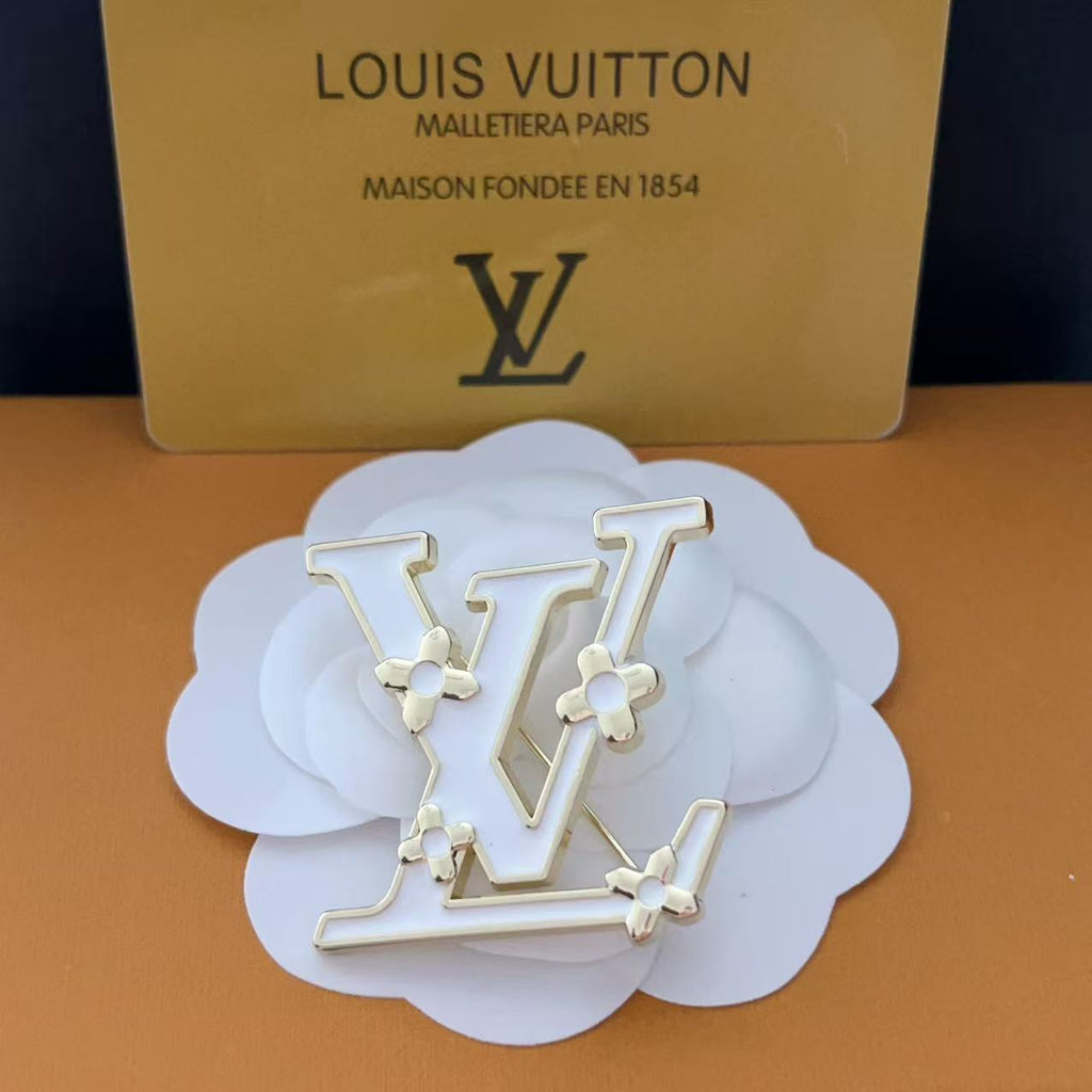 New LV brooch, with label.