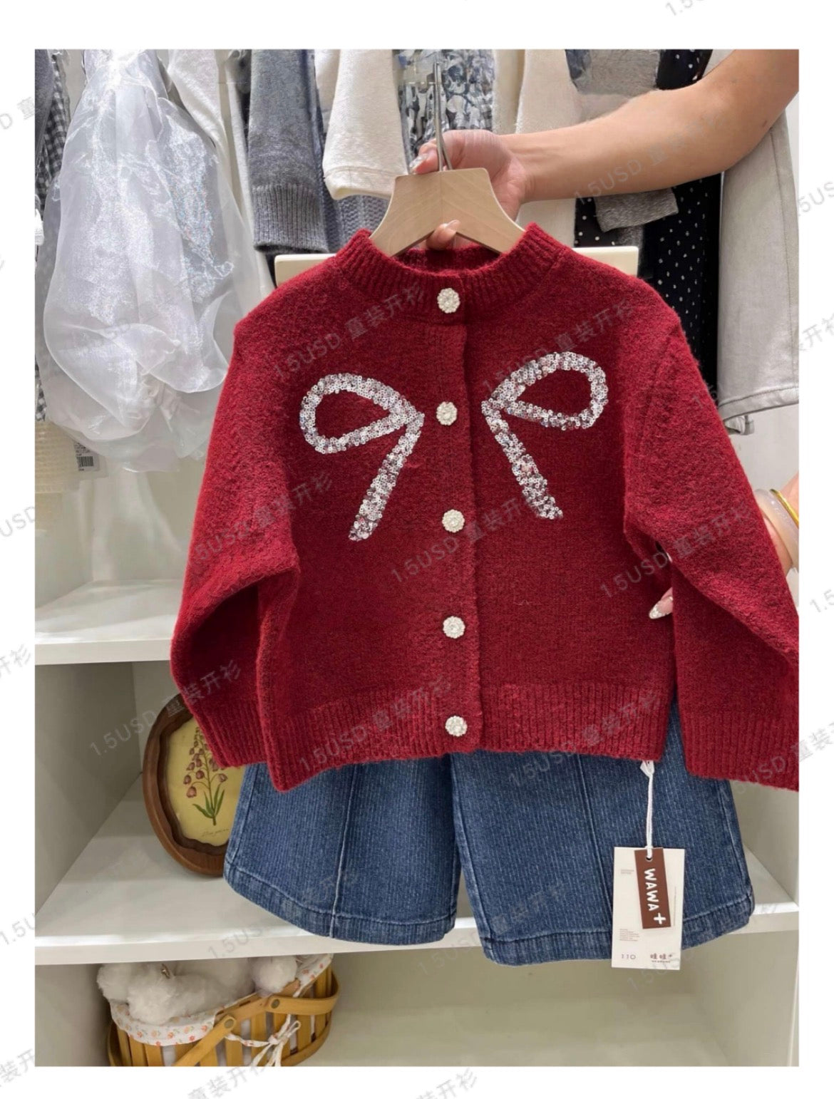 Girls cream cable knit cardigan with patch pockets and ruffled neckline