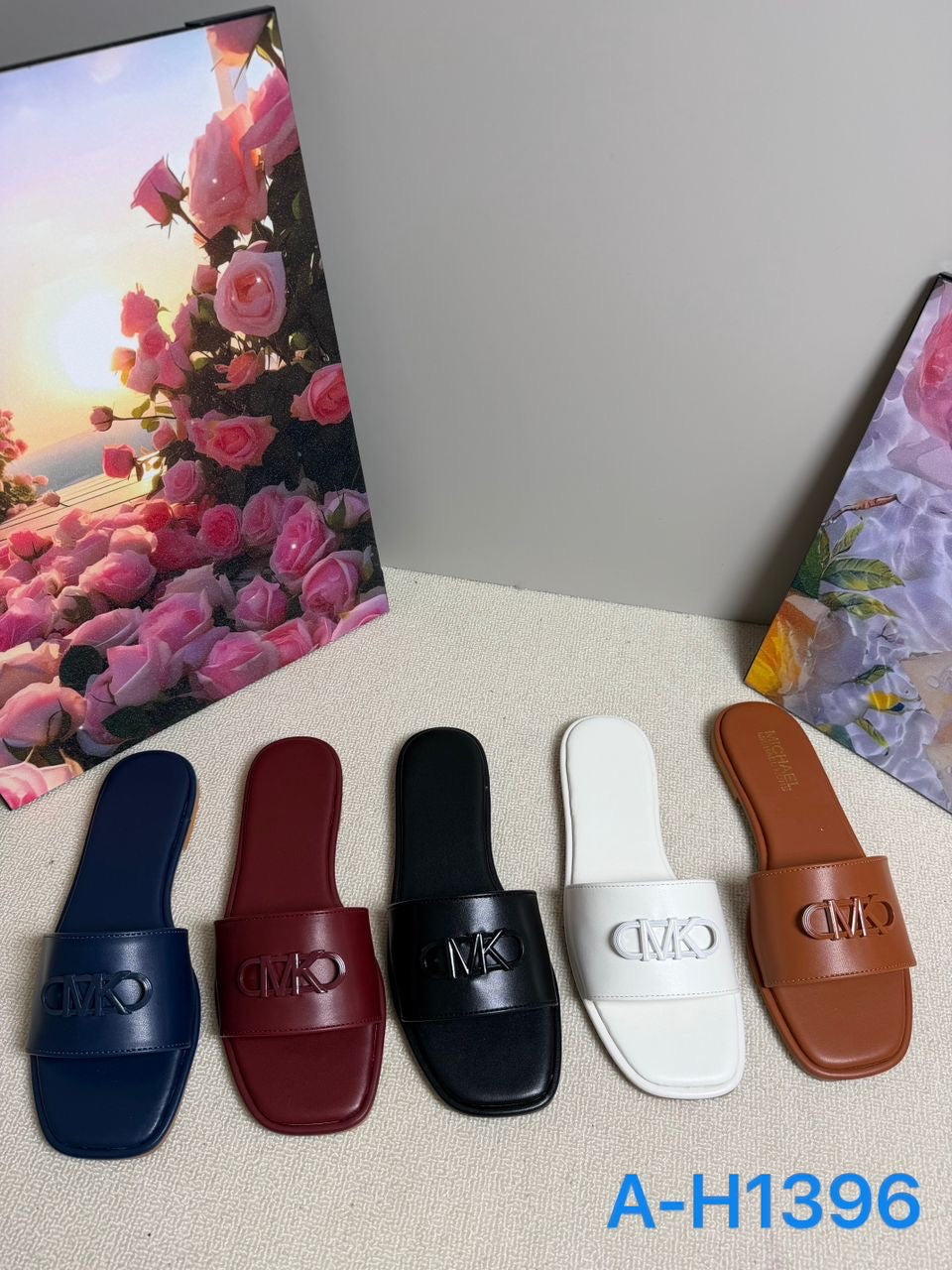 Women's Logo Embossed Flat Slide Sandals Mix A-H1396 – $17.00/unit | MOQ 24